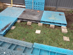 The Wedge Worm Farm - pavers under pallets